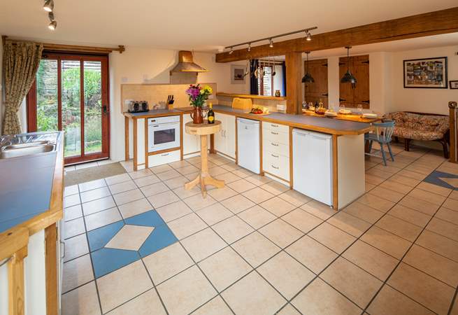 There is plenty of space in the kitchen and dining area. This door leads into the enclosed garden.