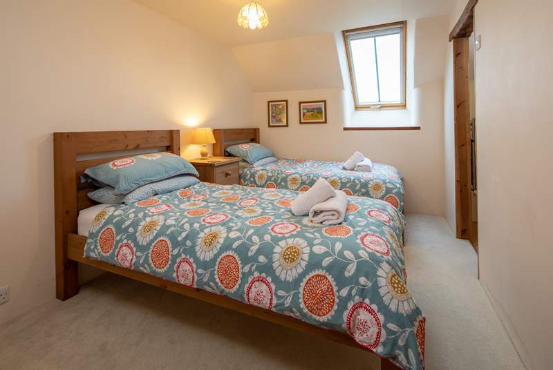 Bedroom 2 offers these charming twin beds.