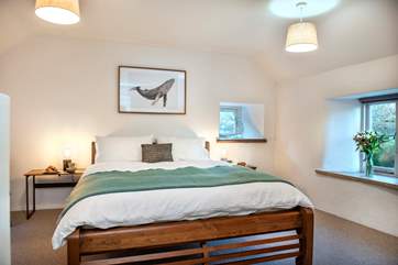 Bedroom 1 is triple-aspect and has a lovely king-size bed.