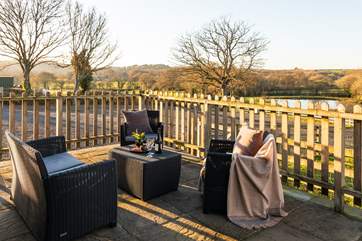 Enjoy your enclosed patio with views across the fields and down to the two lakes.