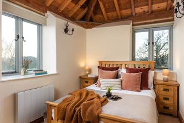 The main bedroom has a wonderful vaulted ceiling and has a fabulous en suite bathroom with a heated towel rail.