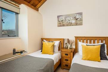 The twin bedroom has lovely views across the rolling hills.