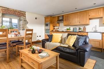 Kingfisher Barn is accessed via its own enclosed garden. Enjoy the open plan living area, a perfect room to relax in.