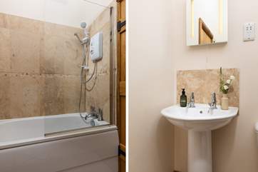 The bathroom sits at the top of the stairs next to the bedroom.