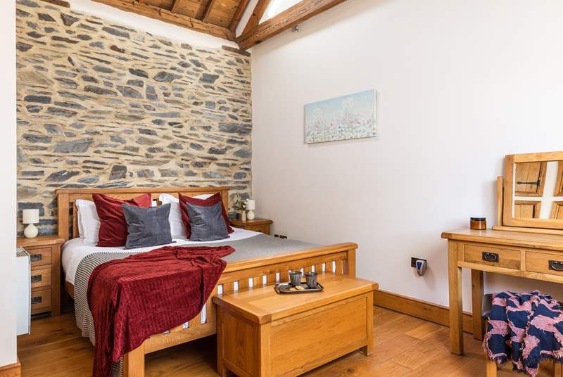 The bedroom has a wonderful exposed wall, vaulted ceiling and views to the front across the fields. For a family of 3 there is now a beautiful day bed, perfect for smaller ones. (photograph to follow)