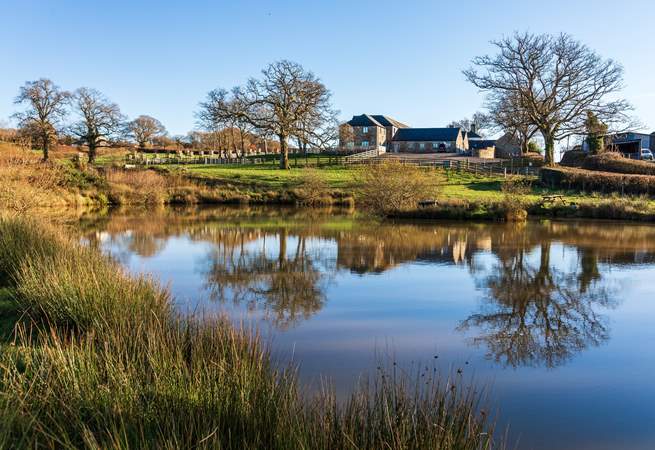 Another view looking back up to the barns from one of the two lakes. Why not enjoy a spot of fishing during your stay?