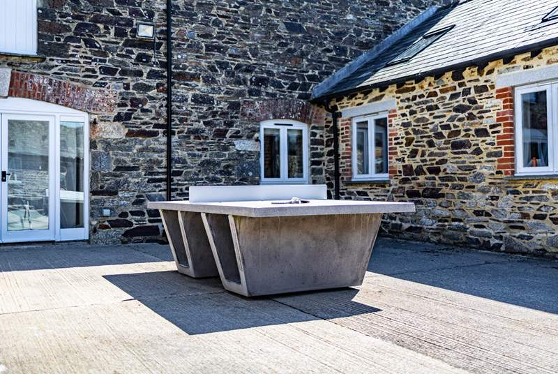 Communal table tennis can be enjoyed in the central courtyard area.