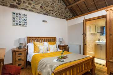 The main bedroom offers character and charm and enjoys an en suite shower-room.