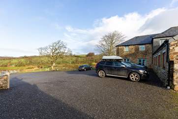 The gravelled parking area for the barns at Netherbridge Lakes.