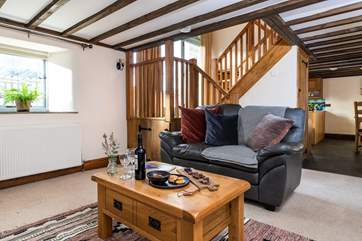 The sitting-area is comfortable and cosy and although on a lower level still floods with light.