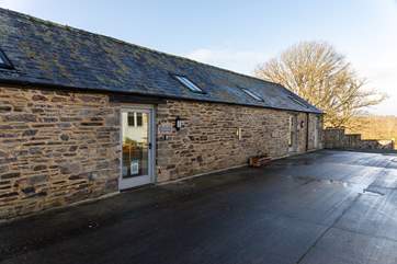 The barn is accessed from the main courtyard area just a few steps away from the parking area for all barns.