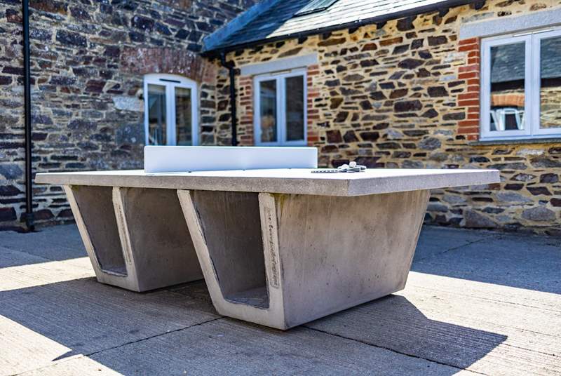 The communal table tennis can be found outside the front door in the courtyard area. 