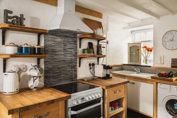 The kitchen also has a washing machine, which is really useful if you are staying for a week, or maybe longer?