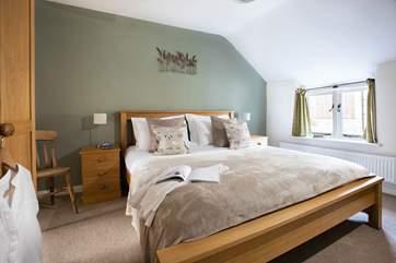This lovely bedroom next to the bunk-room also has a comfy super-king size double bed.