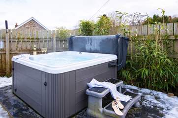 Relax in the warm bubbling water whatever the weather.