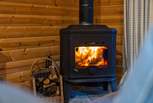 Cosy up together around the roaring wood-burner.