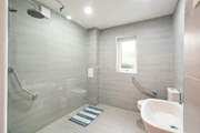 Spacious wet-room on the ground floor.