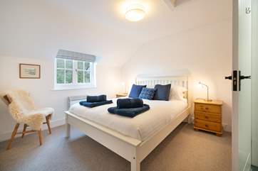 Bedroom 1, a tasteful double room with king-size bed.
