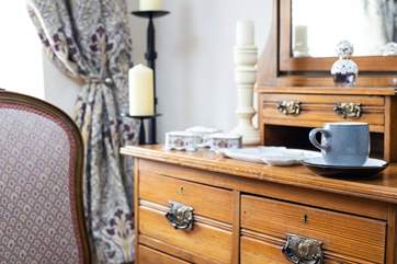 The bedroom is beautifully furnished.