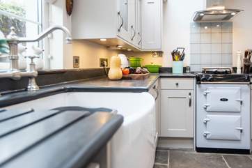 The kitchen comes equipped with a lovely Belfast sink and Aga.