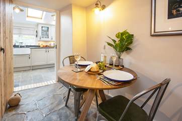 Dinner for two? The seating area has been placed in the hallway of the cottage but feels more like a room owing to its size and finish.