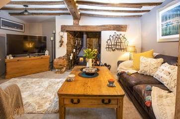 The inviting sitting-room with widescreen TV gives you the opportunity to unwind after a day out exploring.