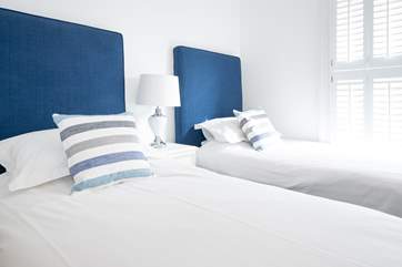 The second bedroom on the first floor with twin beds.