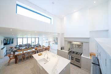 Simply divine, the open plan living-room with kitchen and dining areas has plenty of space for everyone.