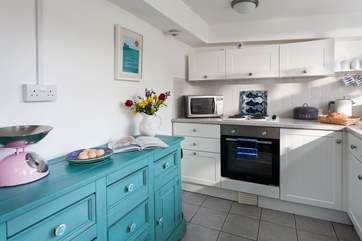 You have a lovely cottage kitchen with all the equipment needed to cook up a feast.