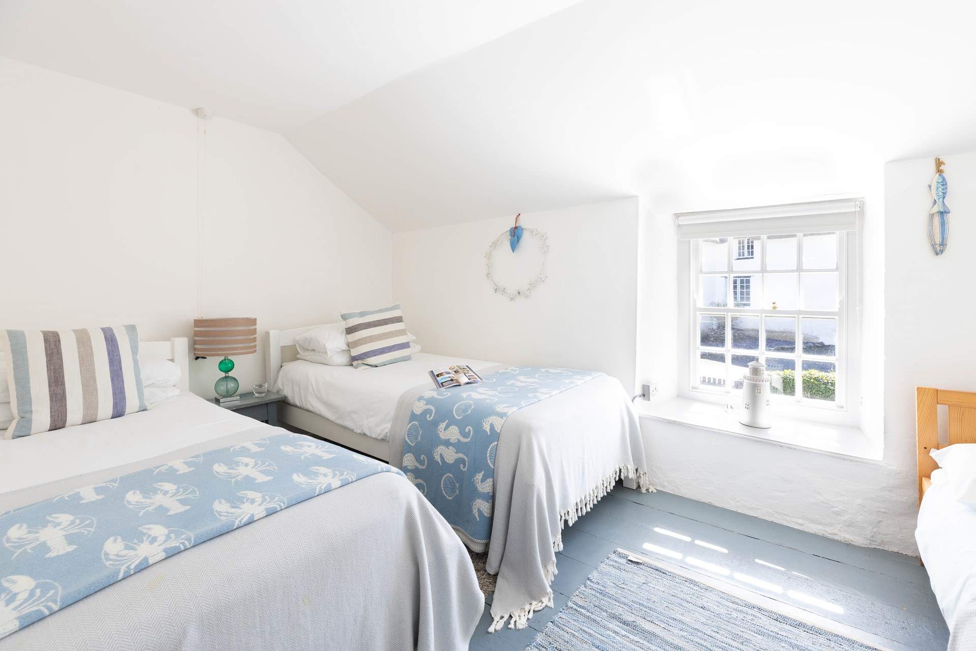 The twin bedroom has a little child bed for an extra guest under the age of eight years old. 