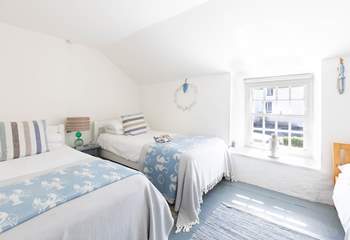 The twin bedroom has a little child bed for an extra guest under the age of eight years old. 