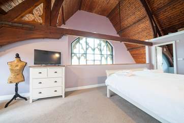 The fourth bedroom is on the mezzanine, overlooking the first floor...