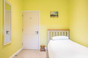 The bright and airy third bedroom on the ground floor with single bed.