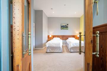 The comfortable second bedroom with twin beds on the ground floor...