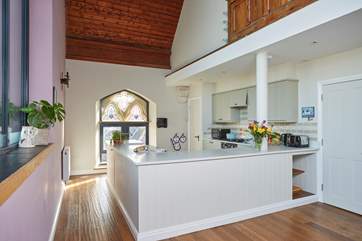 Tall ceilings and lots of light coming through the stain glass windows adds to the wow quality of 1 Church House.