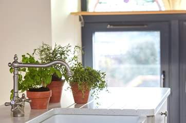 Detail of the tap in bright and airy kitchen.