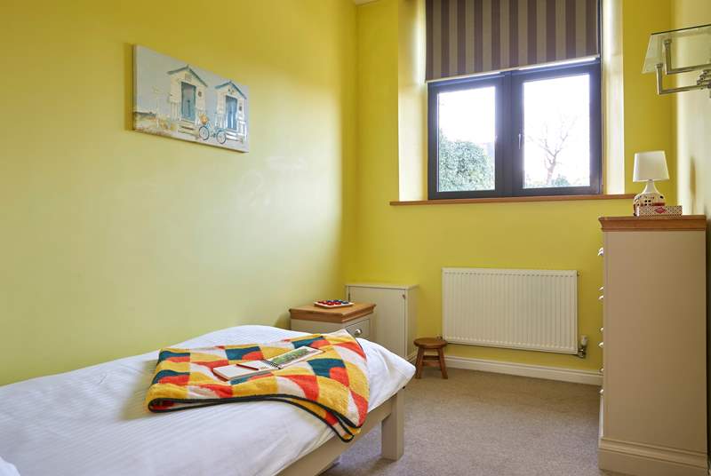 The bright and airy third bedroom on the ground floor with single bed.