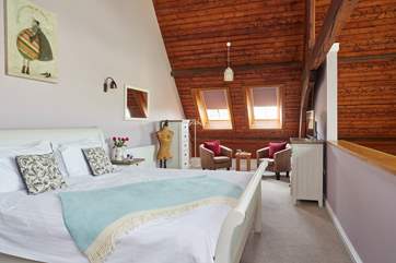 The fourth bedroom is on the mezzanine, overlooking the first floor...