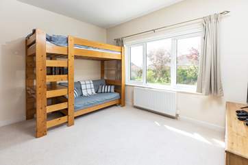 Bedroom 1, on the ground floor, the bunk bedroom is perfect for children (an additional child can be accommodated on the sofa bed by request).