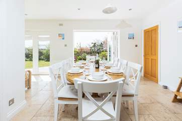 The fabulous kitchen/diner floods with light from the patio doors that open out into the landscaped gardens.