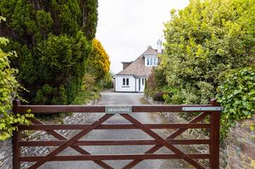 A private drive leads to Greenways.