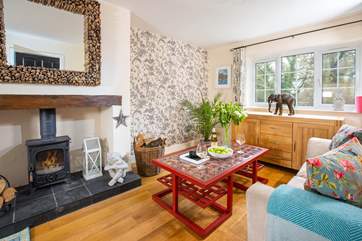 The main sitting-room offers a room full of light leading through to the conservatory.