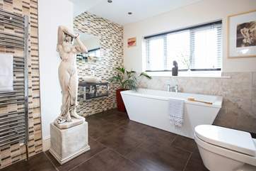 The main bathroom is spacious with every detail thought through. There is even a touch of Roman glamour!