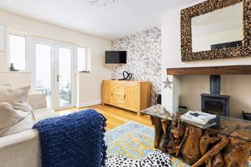 The main sitting-room offers a perfect spot for a family film night.