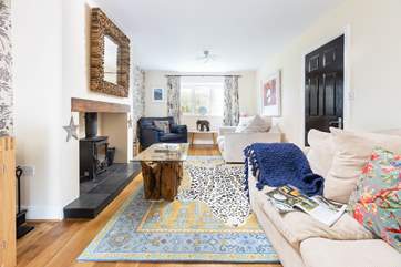 The main sitting-room benefits from that all-important log-burner for those cooler nights.