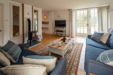 The sitting-room is simply beautiful and opens out on the enclosed patio-area.