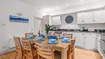 The beautiful kitchen is a sociable place to gather whilst supper bubbles away.