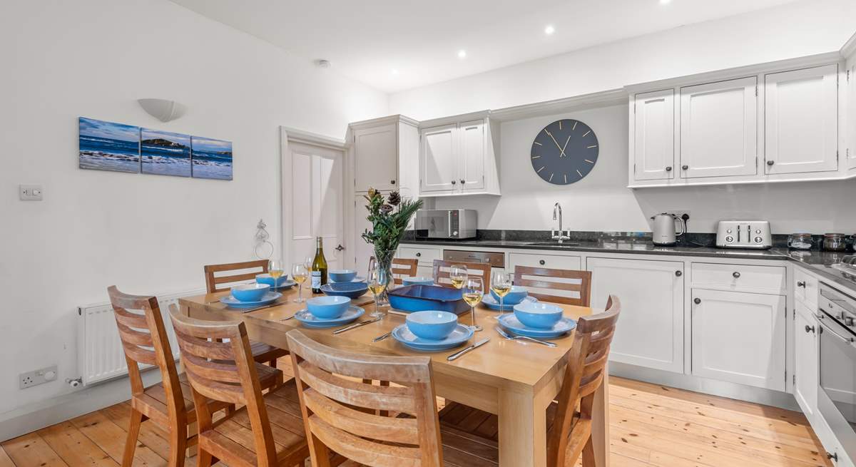 The beautiful kitchen is a sociable place to gather whilst supper bubbles away.