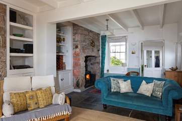 Downstairs all the rooms flow beautifully to create a balmy and relaxing ambiance, you can sink into the large and comfy sofa in the sitting-room while enjoying the flickering flames of the toasty wood-burner