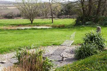 Nestled in 6 acres of gorgeous gardens complete with woodland walks, established shrubs and three relaxing ponds, this charming house for five lucky people and their four-legged friends is the perfect country retreat.